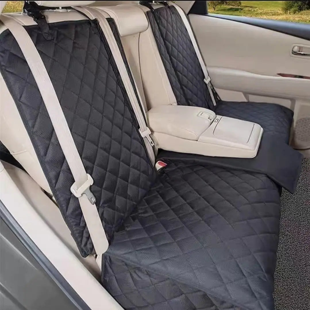 Dog Car Seat Cover with Middle Armrest – black quilted waterproof back seat cover installed in vehicle with seatbelt openings