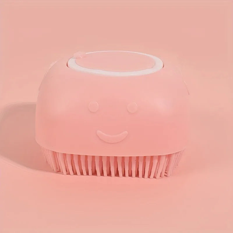 Pink silicone pet grooming brush with soft bristles and a smiley face design