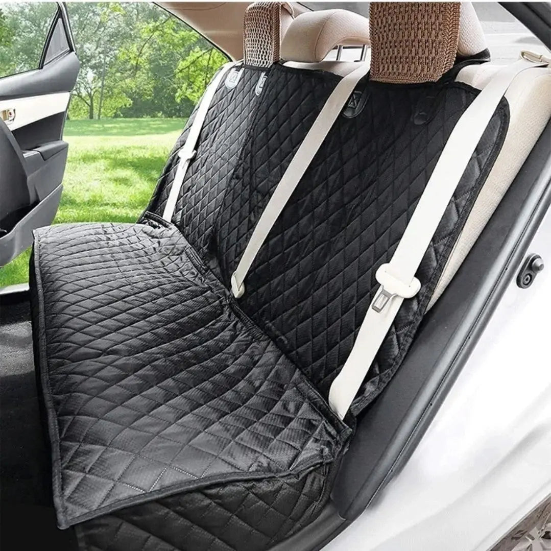 Dog Car Seat Cover with Middle Armrest – side view showing black quilted cover with armrest flap extended and seatbelt access