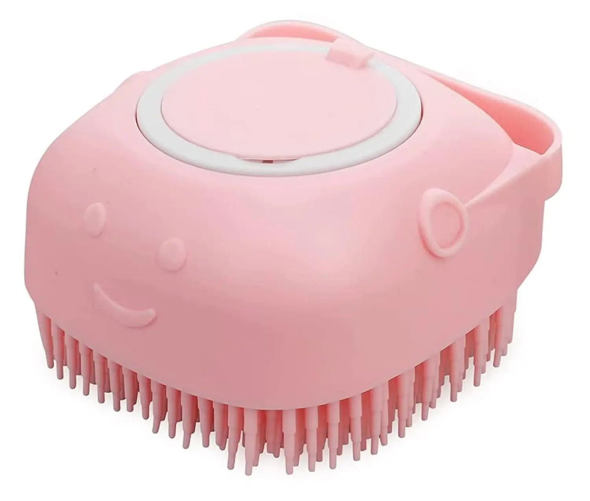Pink silicone pet grooming and bath brush with soft bristles on a white background