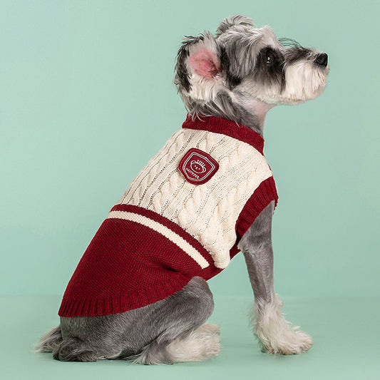 Small dog wearing red knit academy style sweater - front view